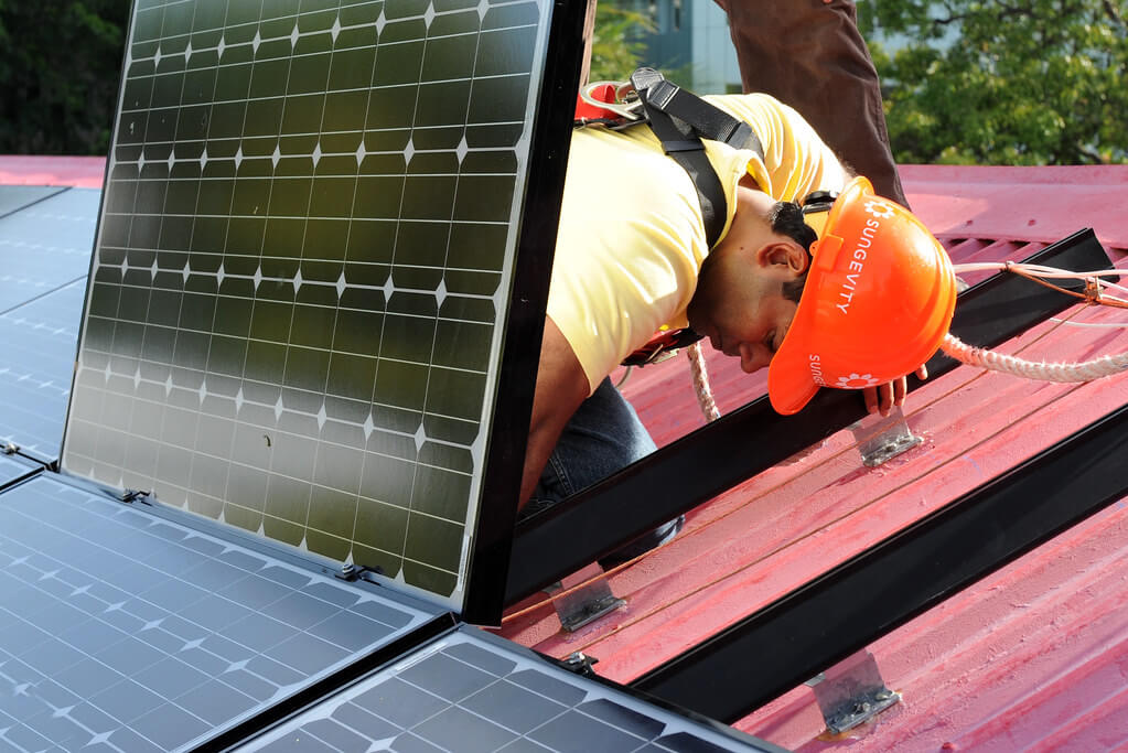 A Simple Guide to How Solar Panels Work (For Homeowners) in 2025 Meta Description: Learn how solar panels work for homeowners in 2025. This simple guide covers solar energy systems, costs, savings, and the Federal Solar Tax Credit to help you save with residential solar panels before it expires on December 31, 2025. Keywords: how solar panels work, solar panel cost, Federal Solar Tax Credit 2025, solar energy systems, solar energy savings, residential solar panels, solar power for home Introduction: Understanding Solar Panels for Your Home With solar energy powering over 7% of U.S. homes in 2025, residential solar panels are a popular way to slash electricity bills, reduce carbon footprints, and boost home value. The 30% Federal Solar Tax Credit, expiring for residential installations on December 31, 2025, makes now an ideal time to explore solar energy systems. But how do solar panels actually work? This beginner-friendly guide explains the process in simple terms, covering components, benefits, and costs to help homeowners make informed decisions. For personalized quotes, visit EnergySage to connect with trusted installers. How Do Solar Panels Work? A Simple Explanation Solar panels convert sunlight into electricity through a straightforward process. Here’s how it works, step by step: Solar Panels Capture Sunlight: What Happens: Solar panels, made of photovoltaic (PV) cells, absorb sunlight. Each cell contains silicon, which generates a small electric current when hit by photons (light particles). Key Component: Most panels use monocrystalline cells (19–22% efficiency) for higher output or polycrystalline cells (15–17%) for lower cost. A 7.2 kW system typically has 18–20 panels (400W each). Inverters Convert Electricity: What Happens: Solar panels produce direct current (DC) electricity, but homes use alternating current (AC). Inverters convert DC to AC for household use. Key Component: String inverters connect multiple panels (cost: $1,000–$2,000), while microinverters (one per panel, $100–$200 each) optimize performance in shaded areas. Electricity Powers Your Home: What Happens: Converted AC electricity flows to your home’s electrical panel, powering appliances, lights, and devices. Any excess energy can be stored or sent to the grid. Key Component: A net meter tracks energy sent to/received from the grid, reducing bills via net metering (credits for excess energy). Battery Storage (Optional): What Happens: Excess energy can be stored in a solar battery (e.g., Tesla Powerwall, 13.5 kWh) for use at night, during outages, or under time-of-use (TOU) rates, saving $500–$1,500/year in high-rate states. Key Component: Lithium-ion batteries (90–96% efficiency) cost $7,000–$18,000 but qualify for the Federal Solar Tax Credit. Grid Connection: What Happens: Most systems are grid-tied, using the utility grid as backup when solar production is low (e.g., at night or cloudy days). Net metering credits excess energy, lowering bills. Key Component: A Permission to Operate (PTO) from your utility ensures safe grid connection. This process allows a 7.2 kW system to generate ~10,800 kWh/year in sunny states (e.g., California), covering most or all of an average household’s 10,632 kWh annual usage. Benefits of Solar Panels for Homeowners Installing solar energy systems offers significant advantages in 2025: Energy Savings: A 7.2 kW system saves $1,000–$3,500/year, depending on state electricity rates ($0.11–$0.33/kWh). Lifetime savings reach $31,000–$100,000 over 25 years, per EnergySage. Federal Solar Tax Credit: Saves 30% on installation costs (e.g., $6,600 on a $22,000 system) for systems installed by December 31, 2025. File IRS Form 5695 to claim it. Home Value Boost: Solar homes sell for 4–6.8% more ($15,000–$27,200 for a $400,000 home), per 2021 Zillow and 2019 LBNL studies. Environmental Impact: Cuts ~8,000 lbs of CO2 annually, equivalent to planting 120 trees, appealing to eco-conscious buyers. Energy Independence: Reduces reliance on rising utility rates (2–4% annually) and outages with battery storage. Solar Panel Costs and Savings in 2025 Understanding solar panel costs helps homeowners weigh the investment: Average Cost: A 7.2 kW system costs $18,144–$26,424 ($2.52–$3.67/W), including panels, inverters, mounting, labor, and permitting, per EnergySage. After Tax Credit: The 30% Federal Solar Tax Credit reduces costs to $12,701–$18,497. State incentives (e.g., New York’s 25% tax credit, up to $5,000) can save more. Check DSIRE for local programs. Battery Costs: Adding a 10–13.5 kWh battery costs $7,000–$18,000, with tax credit savings of $2,100–$5,400. Payback Period: 4–10 years, faster in high-rate states (e.g., CA: $0.33/kWh, 4–6 years) than low-rate states (e.g., ID: $0.11/kWh, 8–12 years). Financing Options: Cash Purchase: Cheapest long-term ($12,701–$18,497 after tax credit). Solar Loans: Zero-down loans add 5.99–8% interest, increasing costs to $26,000–$31,000. Leases/PPAs: No upfront cost but miss tax credits; payments ($50–$150/month) may exceed savings. For cost comparisons, contact trusted installers like Sunrun. Key Considerations for Homeowners Before installing solar panels, consider these factors to maximize solar energy savings: Roof Suitability: South-facing, unshaded roofs with 15–40° slopes maximize output. Complex roofs (steep, tiled) may add $500–$2,000 to installation costs. Energy Usage: Review utility bills to size your system. An average household (10,632 kWh/year) needs a 7.2 kW system; high-usage homes (>15,000 kWh) may need 10–12 kW. Incentives: Combine the Federal Solar Tax Credit with state rebates (e.g., California’s SGIP, $150/kWh for batteries) to cut costs by 30–50%. Check DSIRE. Battery Storage: Essential for outages or TOU rates, but adds $7,000–$18,000. Choose high-efficiency batteries like Tesla Powerwall 3 (90% efficiency, 13.5 kWh). Installer Quality: Work with NABCEP-certified installers to ensure efficiency and 25-year warranties. Compare 3–5 quotes on EnergySage to save 10–20% ($2,000–$4,000). Net Metering: Available in most states, it credits excess energy at retail rates (e.g., 1:1 in Arizona), reducing bills. Verify with your utility provider. Common Misconceptions About Solar Panels “Solar Panels Don’t Work on Cloudy Days”: Panels generate 10–25% of normal output on cloudy days, and grid-tied systems use utility power as backup. “Solar Is Too Expensive”: After tax credits and incentives, net costs are $12,701–$18,497 for a 7.2 kW system, with paybacks in 4–10 years. “Panels Require Constant Maintenance”: Panels need cleaning every 6–12 months ($150–$300) and occasional inspections, with 25–30-year lifespans. “All Solar Systems Are the Same”: Monocrystalline panels (19–22% efficiency) outperform polycrystalline (15–17%), and inverter/battery choices impact performance. FAQs About How Solar Panels Work in 2025 How much electricity do solar panels produce? A 7.2 kW system generates ~10,800 kWh/year in sunny states (CA, AZ) or 8,600 kWh in cloudy states (WA, ME), covering most of an average household’s 10,632 kWh/year. How much do solar panels cost in 2025? A 7.2 kW system costs $18,144–$26,424 ($2.52–$3.67/W). After the 30% Federal Solar Tax Credit, costs drop to $12,701–$18,497. Can solar panels power my home at night? Yes, with a solar battery (e.g., 10–13.5 kWh, $7,000–$18,000) or grid connection via net metering. Batteries store daytime energy for nighttime use. Do solar panels work during outages? Grid-tied systems shut off during outages for safety unless paired with a battery (e.g., Tesla Powerwall 3, 13.5 kWh) for backup power (12–48 hours). Is the Federal Solar Tax Credit still available? Yes, the 30% tax credit applies to systems installed by December 31, 2025, saving $5,443–$7,927 on a $18,144–$26,424 system. It’s nonrefundable but rolls over. Conclusion: Go Solar with Confidence in 2025 Solar panels work by converting sunlight into electricity through photovoltaic cells, inverters, and optional batteries, offering homeowners solar energy savings of $1,000–$3,500/year and a 4–6.8% home value boost. With solar panel costs at $12,701–$18,497 after the Federal Solar Tax Credit (expiring December 31, 2025), 2025 is the perfect year to invest in solar energy systems. Start by comparing quotes from trusted installers like Sunrun on EnergySage and check state incentives on DSIRE to maximize savings. Embrace clean energy, cut bills, and power your home sustainably! Disclaimer: Solar costs and savings vary by location, usage, and installer. Consult a tax professional for Federal Solar Tax Credit advice and verify installer credentials before signing contracts.